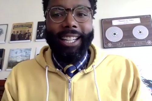 Hakim Bellamy smiling at the camera.