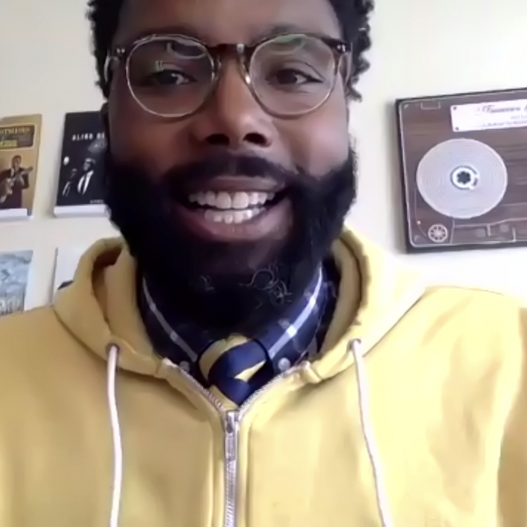 Hakim Bellamy smiling at the camera.