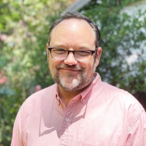 Chris smiling at the camera.