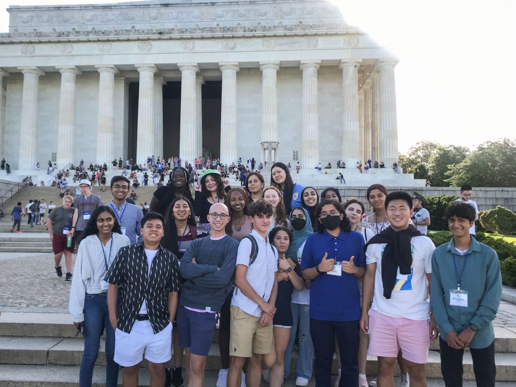 A group of young people outisde the Lincoln Memorial.