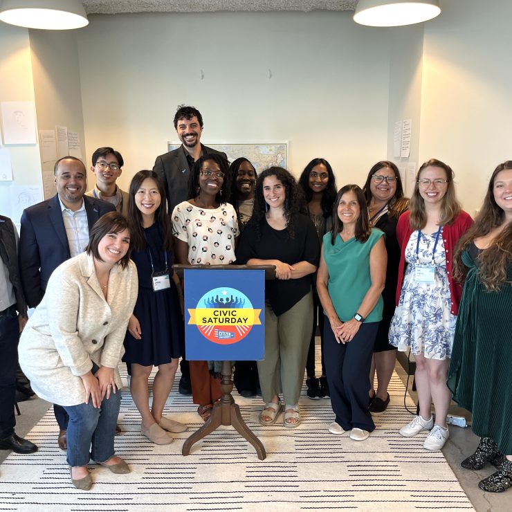 A group of civic saturday fellows smiling together.