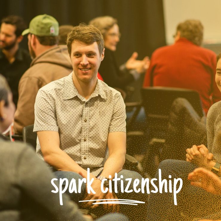 People sitting in a small group chatting together, with the text, spark citizenship.