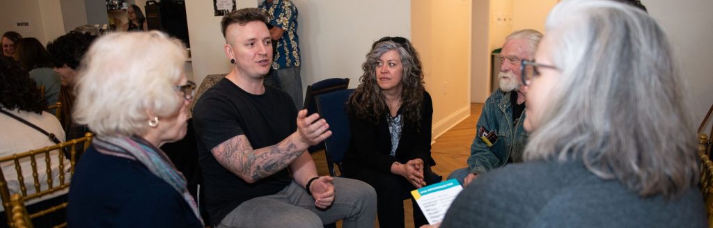 A group of people chatting together