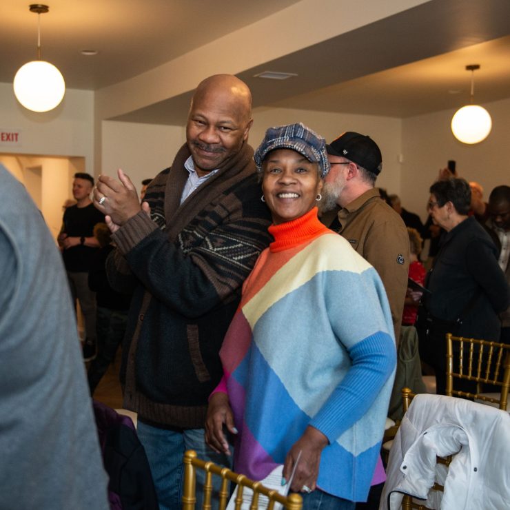 Two people standing together and smiling 