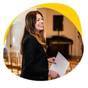 A portrait of Kate Tucker smiling.