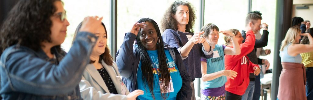 People smiling standing together.